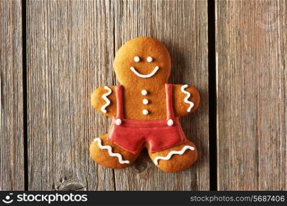 Christmas homemade gingerbread man on wooden table