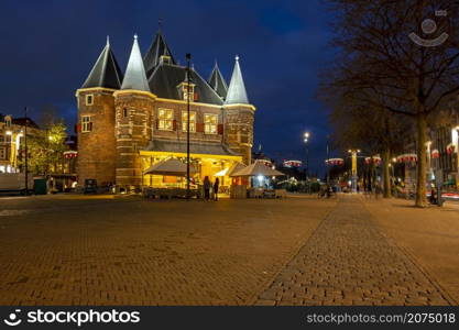 Christmas in Amsterdam at the Nieuwmarkt with the Waag building in Amsterdam at sunset