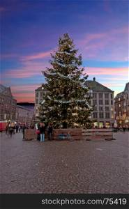 Christmas in Amsterdam on the Damsquare in the Netherlands at sunset