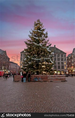 Christmas in Amsterdam on the Damsquare in the Netherlands at sunset