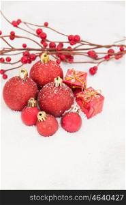 Christmas in red. Balls and gifts with snow for the Xmas tree decoration