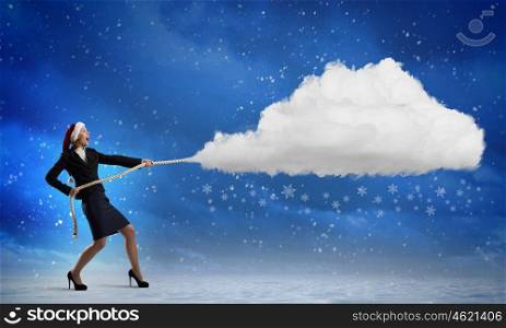 Christmas is coming. Santa woman pulling white cloud on rope
