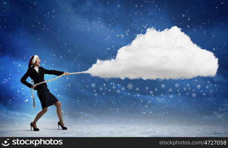 Christmas is coming. Santa woman pulling white cloud on rope