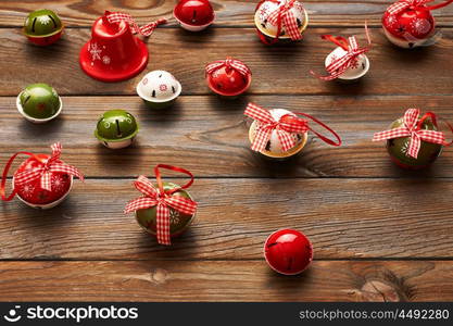 Christmas jingle bells decoration on wooden background