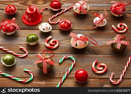 Christmas jingle bells decoration on wooden background