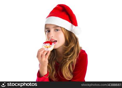 Christmas kid girl eating Xmas Santa cookie isolated on white background