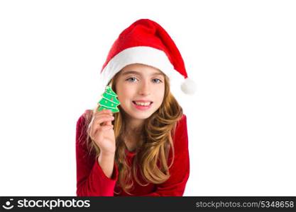 Christmas kid girl holding Xmas tree cookie isolated on white background
