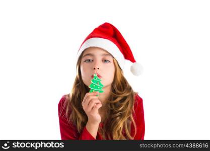 Christmas kid girl kissing Xmas tree cookie isolated on white background