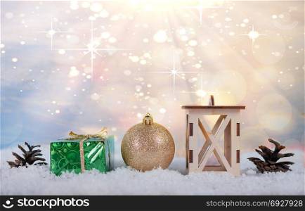 Christmas light background with cones, Christmas toys, boxes and lamps standing in the snow