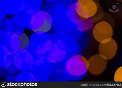christmas lights defocused background. christmas abstract orange and blue lights bokeh defocused background