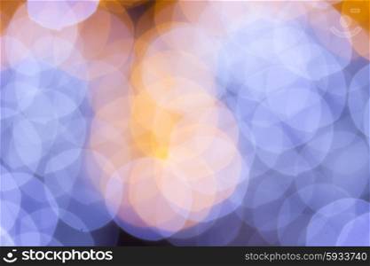 christmas lights defocused background. christmas abstract pale blue and orange lights bokeh defocused background
