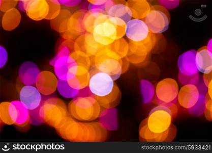 christmas lights defocused background. christmas abstract yellow and violet lights bokeh defocused background