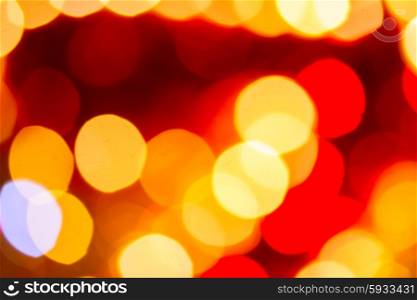 christmas lights defocused background. christmas bright yellow and red lights defocused background