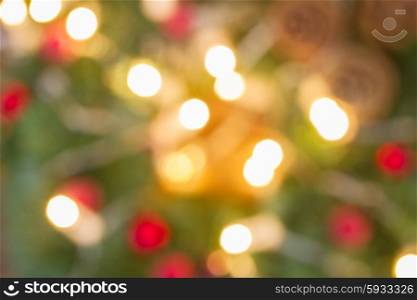 christmas lights defocused background. decorated christmas fir tree with lights defocused background