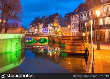 Christmas Little Venice in Colmar, Alsace, France. Traditional Alsatian half-timbered houses in Petite Venise or little Venice, old town of Colmar, decorated and illuminated at christmas time, Alsace, France