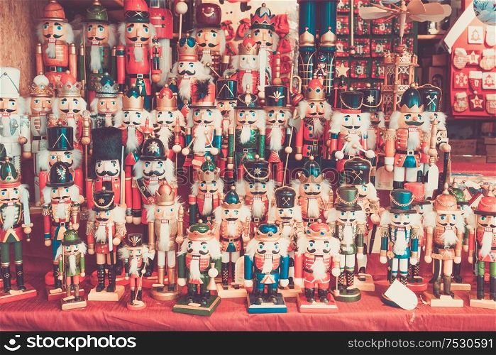 Christmas market kiosk details - traditional festive figurines decorations for sale, retro toned. Christmas market kiosk details