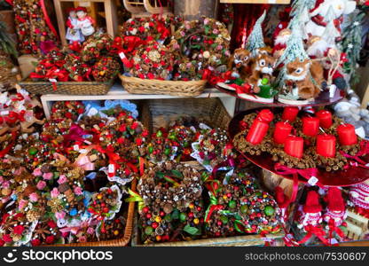 Christmas market kiosk details with christmas wreath and candles. Christmas market kiosk details