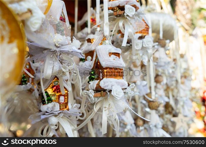 Christmas market kiosk details with hanging christmas tree decorations with angels. Christmas market kiosk details