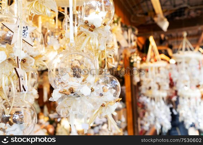 Christmas market kiosk details with hanging christmas tree decorations with decorations. Christmas market kiosk details