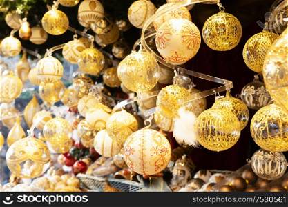 Christmas market kiosk details with wide choice of christmas golden tree decorations. Christmas market kiosk details