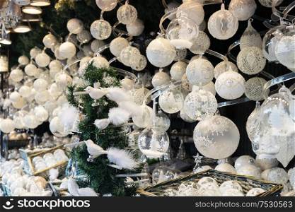 Christmas market kiosk details with wide choice of christmas white tree decorations. Christmas market kiosk details