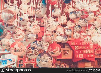 Christmas market kiosk - traditional hanging festive christmas tree decorations, retro toned. Christmas market kiosk details