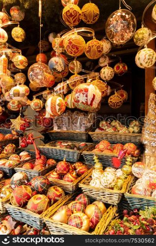 Christmas market stall details with wide choice of christmas tree decorations. Christmas market kiosk details