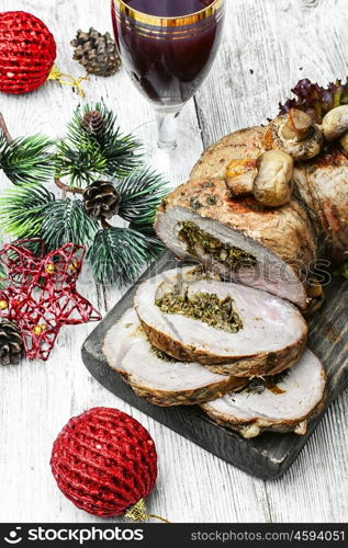 Christmas meat treats. Christmas baked meat loaf on the table decorated for Christmas