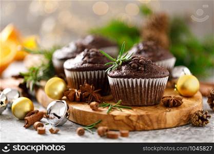 Christmas muffins. Chocolate Xmas or Noel festive bake with decorations and fir tree