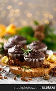 Christmas muffins. Chocolate Xmas or Noel festive bake with decorations and fir tree
