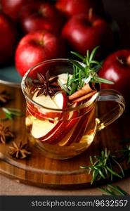 Christmas mulled apple cider with cinnamon, anise and rosemary. Traditional hot drink or beverage, festive Xmas or New Year winter cocktail