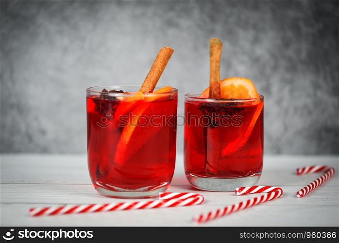 Christmas mulled wine delicious holiday like parties candy cane orange cinnamon star anise spices for traditional christmas drinks winter holidays homemade red mulled wine glasses decorated table