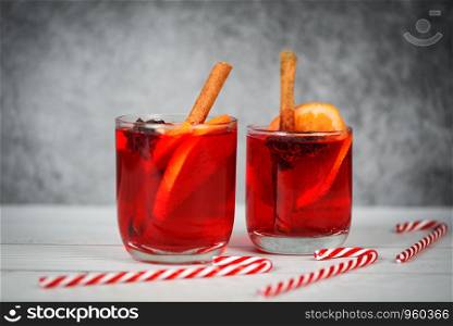 Christmas mulled wine delicious holiday like parties candy cane orange cinnamon star anise spices for traditional christmas drinks winter holidays homemade red mulled wine glasses decorated table