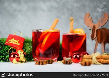 Christmas mulled wine delicious holiday like parties with orange cinnamon star anise spices for traditional christmas drinks winter holidays red mulled wine glasses reindeer decorated table