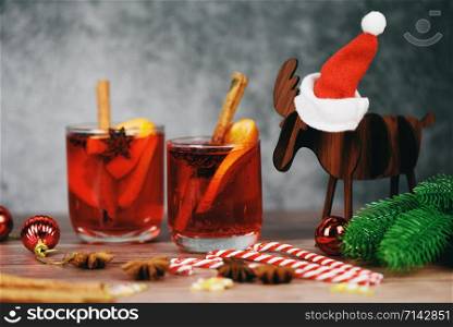 Christmas mulled wine delicious holiday like parties with orange cinnamon star anise spices for traditional christmas drinks winter holidays red mulled wine glasses reindeer decorated table