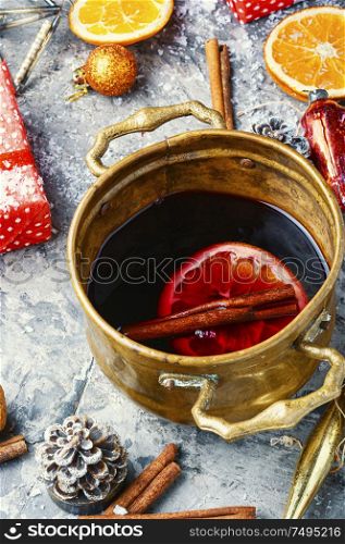 Christmas mulled wine hot alcoholic drink.Mulled wine and decorations for the winter holidays.Christmas symbols. Mulled wine for Christmas