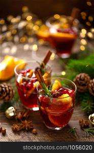 Christmas mulled wine. Traditional festive drink with decorations and fir tree