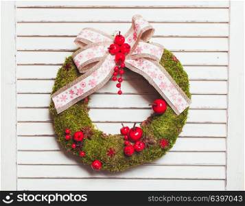 Christmas natural wreath with moss and berries. Christmas natural wreath