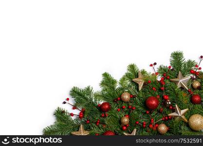Christmas New year decoration frame isolated on white , fir tree branches , red and golden baubles , pine cones , stars , copy space for text. Christmas decoration frame