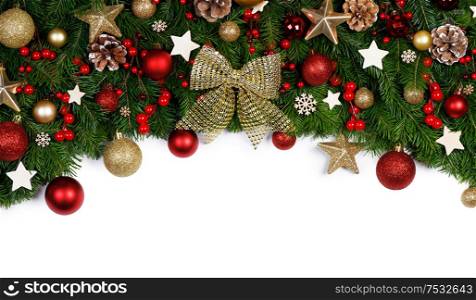 Christmas New year decoration frame isolated on white , fir tree branches , red baubles and pine cones , wooden decor , red berries , copy space for text. Christmas decoration frame
