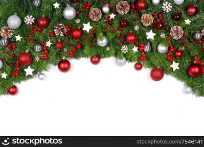 Christmas New year decoration frame isolated on white , fir tree branches , red and silver baubles and pine cones , copy space for text. Christmas decoration frame
