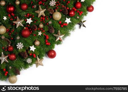 Christmas New year decoration frame isolated on white , fir tree branches , red and golden baubles and pine cones , wooden decor , red berries , copy space for text. Christmas decoration frame