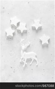 Christmas, New Year or Noel holiday festive decorations, stars and deer on white background, flat lay composition, top view