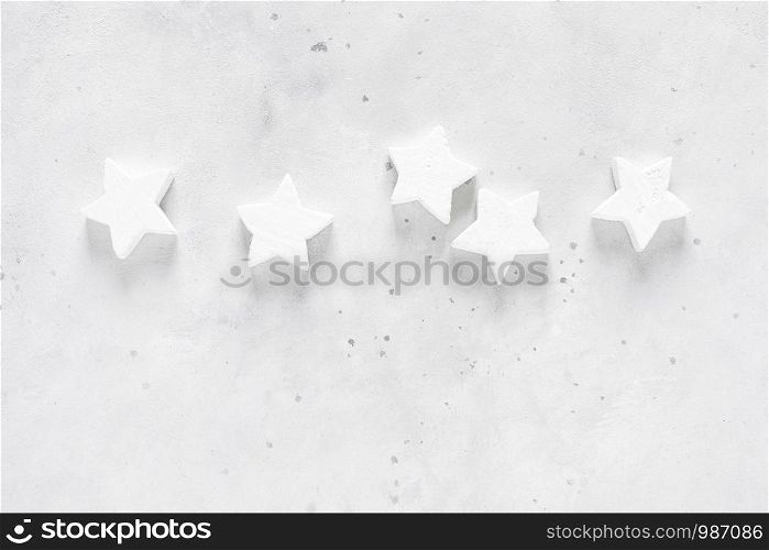 Christmas, New Year or Noel holiday festive decorations, stars on white background, flat lay composition, top view