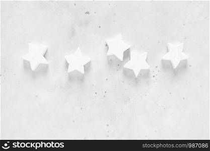 Christmas, New Year or Noel holiday festive decorations, stars on white background, flat lay composition, top view