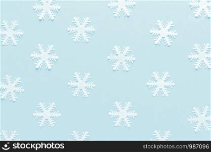 Christmas, New Year or Noel holiday festive winter greeting card with decorations, snowflakes on blue background, flat lay composition, top view