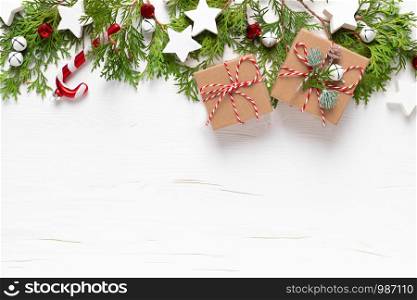 Christmas, New Year or Noel holiday festive winter greeting card with decorations, gift, x-mas ornaments, stars and xmas bells on white background, flat lay composition, top view, space for text