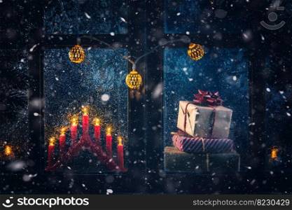 Christmas, new year, winter composition. Gifts and Candles behind a frozen window with frosty patterns. Christmas, winter composition. Gifts and Candles