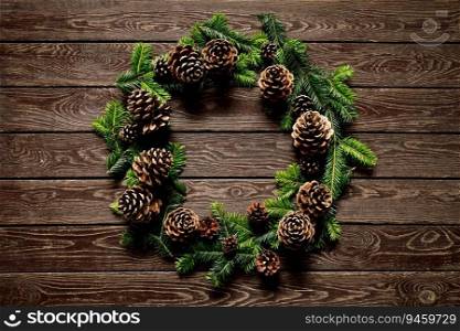 Christmas, Noel or New Year background with Christmas tree, Christmas wreath on wooden background, festive greeting card, holiday banner with copy space for a text, top down view