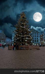 Christmas on the Dam in Amsterdam by full moon in the Netherlands